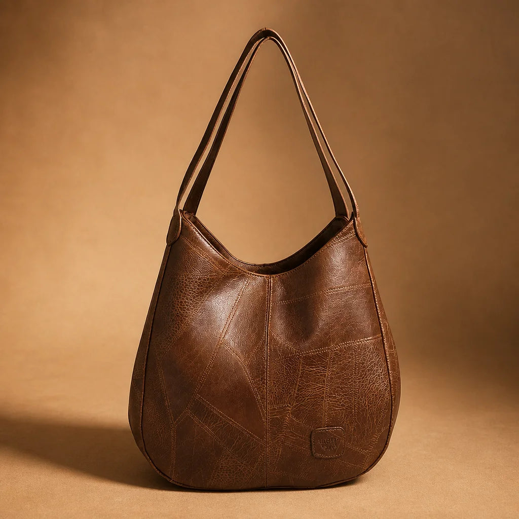Minimal editorial product portrait, 1:1 square. Place the exact brown Vintage Elegance hobo bag alon
