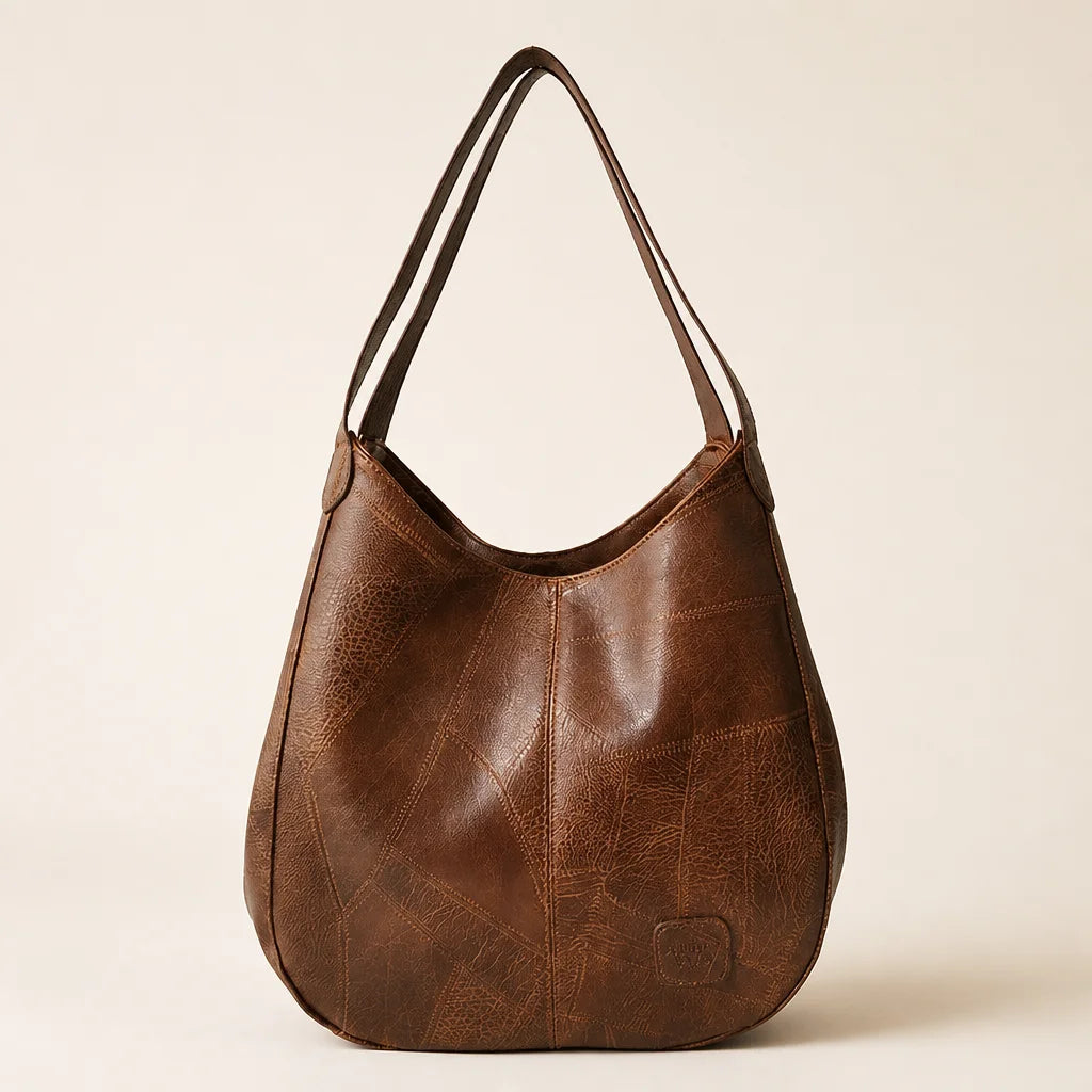Clean isolated fashion product photograph, 1:1 square. Show the exact brown Vintage Elegance hobo ba