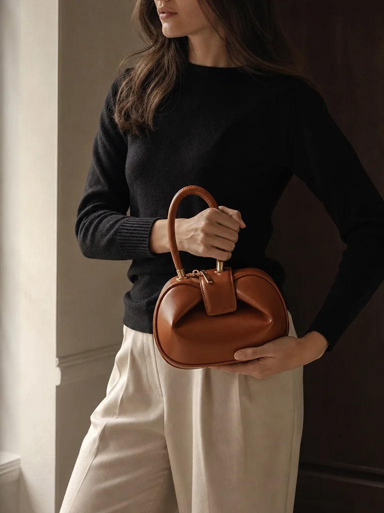 Professional reference-worn fashion photograph, 3:4 portrait. Show one adult woman from shoulder to