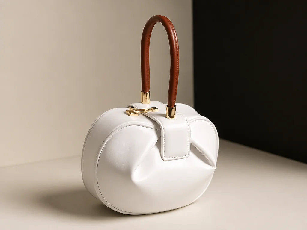 Clean isolated fashion product photograph, 4:3 landscape. Show the exact white Signature Elegance ha