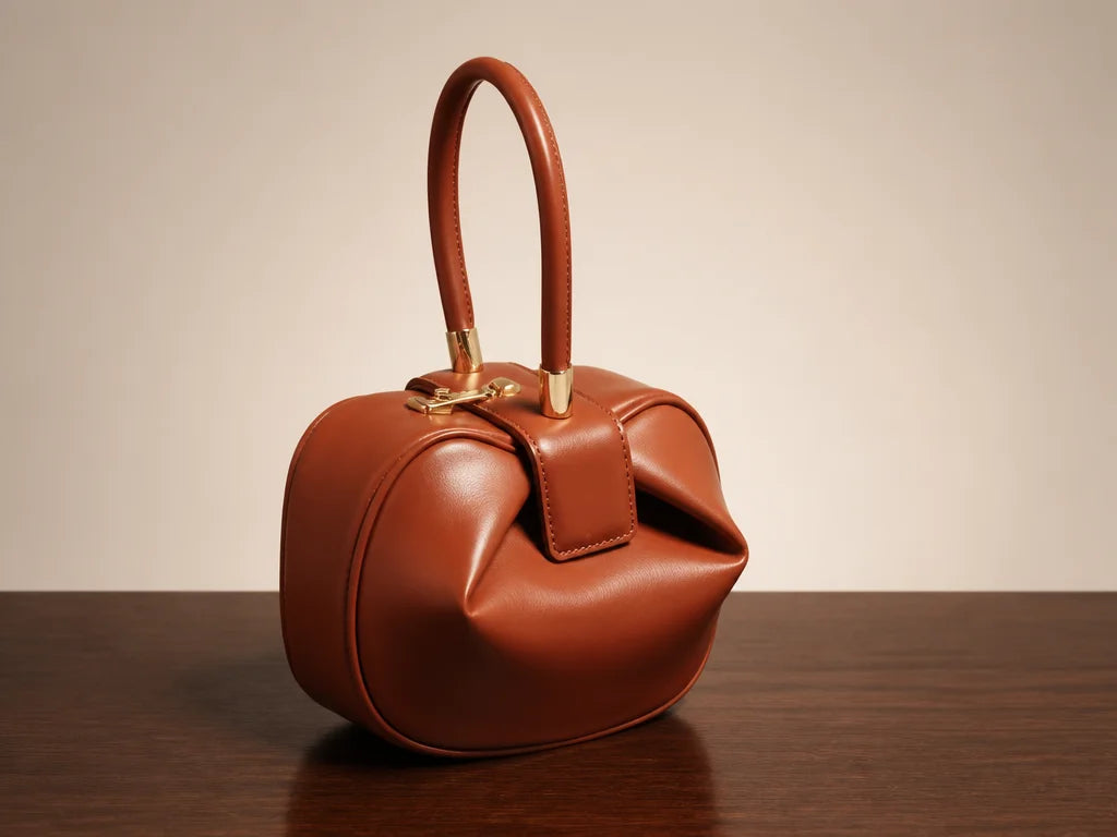 Clean isolated fashion product photograph, 4:3 landscape. Present the exact brown Signature Elegance